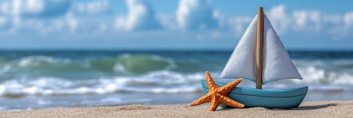 Wall Mural - A miniature sailboat and starfish resting on the sandy beach with ocean waves in the background