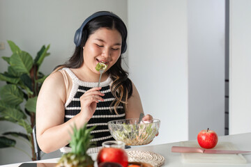 Young Woman Enjoying a Healthy Salad at Home for a Balanced Lifestyle and Wellbeing