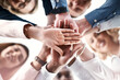 © Koegelenberg Coop/peopleimages.com - Below, business people or hand stack in office for trust, synergy or positive reinforcement. Teamwork, colleagues or gesture in workplace for cooperation, agreement or corporate project collaboration