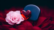 © Omri - A red glass heart lies on red petals