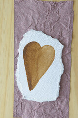 Canvas Print - brown heart on paper with rag texture and wood