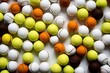 © Oratai - Tennis balls in a random arrangement on a pure white surface, with a focus on the intricate surface texture and rich color contrasts