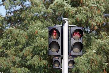 For pedestrians and cyclists, a traffic light on a road that is set to red