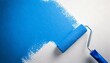 © Lisa Willen - A blue paint roller painting a white wall with blue paint, editable colors