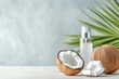 © WE.ARE.AI - Coconut oil facial mist bottle with a fresh coconut split open next to it, coconut oil cosmetic, refreshing skincare product