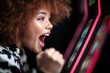 © Konstiantyn Zapylaie - Excited woman winning at slot machine in vibrant casino setting