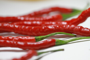 a bunch of red and green chilies