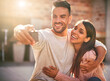 © FotoPush/peopleimages.com - Couple, hug and bonding with selfie, smile and photography for romance in date, memory and anniversary. Profile picture, man and love for woman, happy and care for moment, social media and embrace