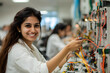 © A2Z AI  - Happy Female Indian Engineering Student Working on a Machine – Empowering Women in STEM