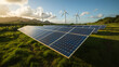 © Eing - Solar Panels and Wind Turbines in Green Field with Mountains in the Background