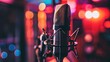 © Steve - Close-up of microphone on stand in soundproof recording studio, positioned in front of script stand, symbolizing voice acting and audio production.