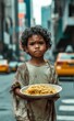 © Bargais - A sad young homeless boy holding a empty plate.