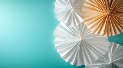 Poster - Artistic paper decorations with pleats and folds are beautifully arranged against a light blue background, showcasing creativity, precision, and aesthetic design.