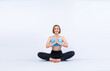 © InfiniteFlow - Full body length gaiety shot athletic and sporty woman doing healthy and meditative yoga exercise workout posture on isolated background. Healthy active and body care lifestyle