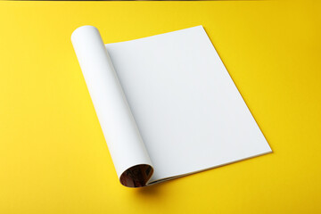 Poster - Open magazine with blank page on yellow background. Mockup for design