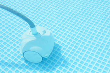 Canvas Print - One robotic cleaner in swimming pool outdoors, space for text