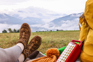 Sticker - Woman wearing trekking shoes and lying in tent outdoors, closeup