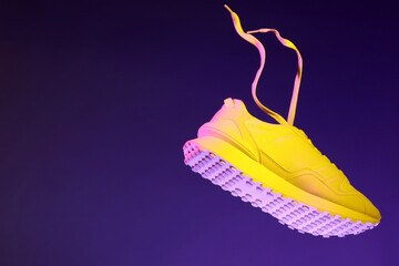 Sticker - Stylish sneaker in air against dark purple background in neon lights, space for text