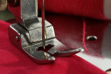 Canvas Print - One sewing machine on color background, macro view