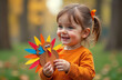 © Юлия Васильева - Adorable little girl having fun on beautiful autumn day. Cute child having fun outdoors.