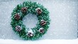 © Photography09 - Wreath made of green tinsel and pinecones on a snowy window, winter coziness