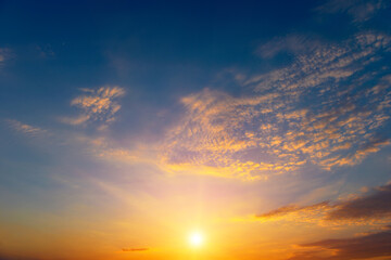 Wall Mural - beautiful sunset with bright sun and blue sky.