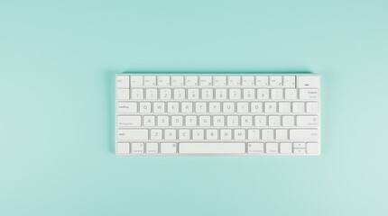 A close-up view of a sleek white computer keyboard on a turquoise surface highlighting its simple, elegant design