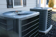 © Vera - close-up shot of a split HVAC system unit showcasing the technology and machinery behind air conditioning and heating in a house.