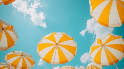 Beach umbrellas under a summer sky