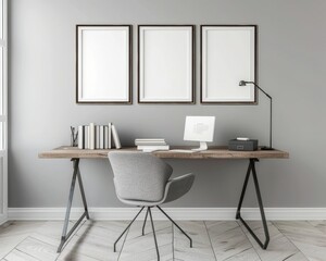 Minimal home office interior design with a computer, books, a chair, and three empty frames on a gray wall. Natural daylight streams in, creating a bright and airy ambiance