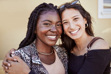 Wall Mural - Friendship hug, students and portrait in city with happiness, sisterhood bonding and travel. Women, smile or embrace on sidewalk for reunion, study break vacation or diversity in healthy relationship