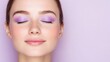 © Elysian Essence - Woman with purple eye shadow, natural skin and soft pink lips, glowing beauty portrait, minimalistic and elegant style, lavender background, modern beauty concept
