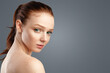 © Prostock-studio - Attractive Shirtless Young Woman With Red Hair And Ponytail Hairstyle Looking Sensually At Camera Posing Standing Over White Background. Studio Shot. Female Beauty Portrait Concept