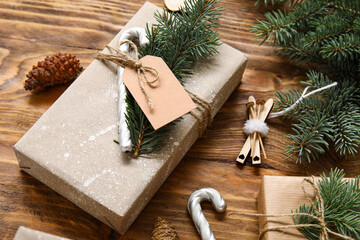 Composition with beautiful Christmas gifts, decor and fir branches on wooden background