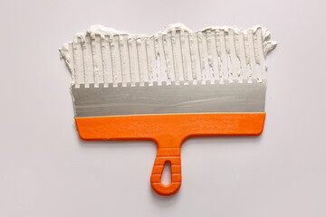 Knife with putty on white background