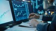 © aubriella - A financial analyst at their desk, reviewing stock market charts and graphs, Financial office scene