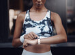 © CourtH/peopleimages.com - Woman, hands and outdoor with fitness watch, check progress and training stats in urban town. Female person, athlete and exercise to monitor heart rate or pulse, running and app for tracking steps