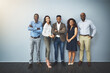 © JordaanExams/peopleimages.com - Business people, team and diversity with about us by background, happy realtor group and confident in profession. Real estate agent, arms crossed and employees smile for career pride in portrait