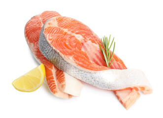 Two fresh salmon steaks, lemon and rosemary isolated on white