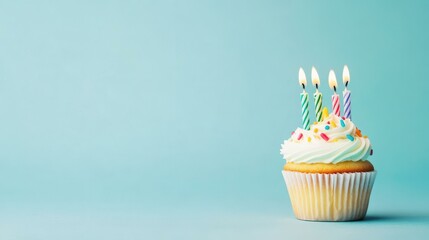 Canvas Print - A vibrant birthday cupcake adorned with candles, set against a soft blue backdrop for a cheerful celebration.