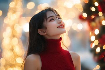 Indonesian girl wearing red knit sweater with copy space for christmas background