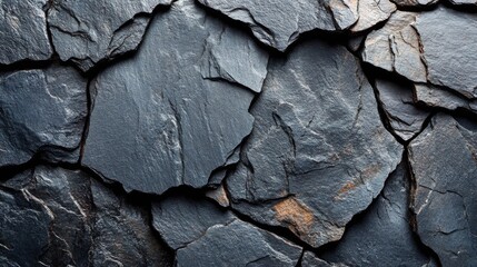Poster - The close-up presents a textured surface of slate rock, highlighting the diverse shapes and colors of the individual stones. Each piece adds to the overall natural beauty.