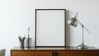 © 楠 刘 - Surrealist Bauhaus style bedroom, with a blank vertical frame on the dressing table and a silver metal desk lamp. High resolution daytime indoor photography with a minimalist and modern design.