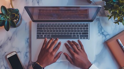 Poster - A person typing on a laptop surrounded by plants and a smartphone, creating a workspace ambiance.