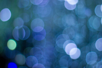 Colorful abstract blurred circular bokeh lights of small hanging lamps