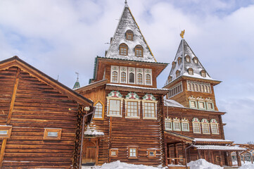 The wooden royal palace, built in the village of Kolomenskoye near Moscow in the second half of the XVII century. Wooden architecture. Log palace in winter in Moscow.The building is made of large logs