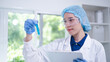 © Supapich - Professional expertise woman research scientist compare blue liquid in test tube or glassware beaker in chemical scientific experiment laboratory, female doctor pharmacy biology medicine person
