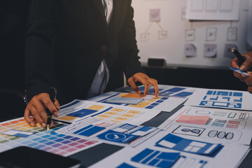 The designer team is designing the uxui system to make the uxui system work well on new phones and support system updates. Website development concept UI UX front end designer