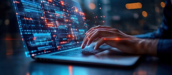 Canvas Print - Person's hands typing on a laptop with a bright blue and red screen displaying digital information.