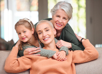 Poster - Women, generations and family with happiness on sofa at home for support, care and bonding in Germany. People, mother and grandmother with girl on portrait in living room for visit, break and relax